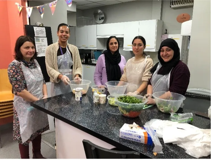 A group of people at the cook and eat event at the bridgelink centre